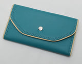 Slim Tri-fold wallet in teal vinyl with tan piping and cotton interior